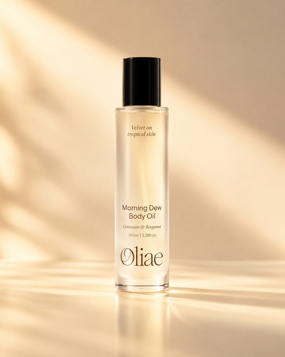 Morning Dew Body Oil bottle in warm studio light with soft window shadows