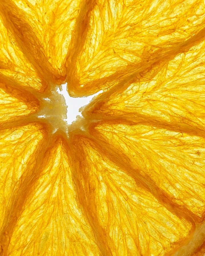 A backlit orange slice